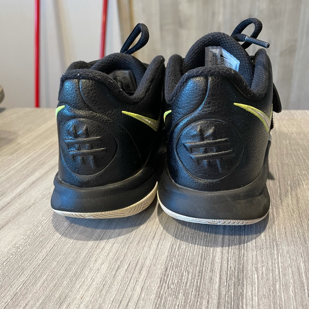 Black, white, lime green Nikes